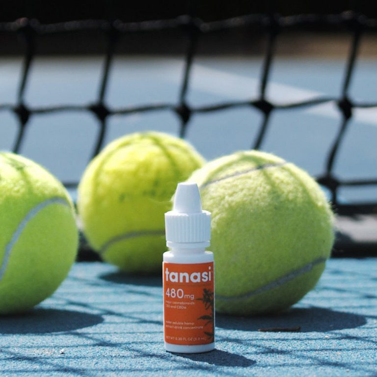 tanasi cbd hemp extract water soluble drink concentrate on tennis court