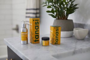 Tanasi CBD lotion and salve on bathroom counter
