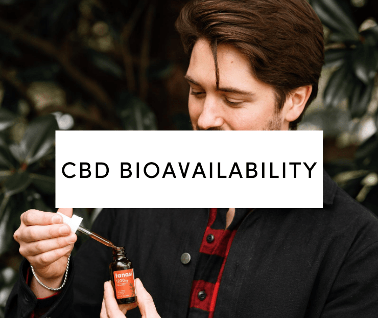 Man in flannel shirt in nature holding a Tanasi CBD tincture