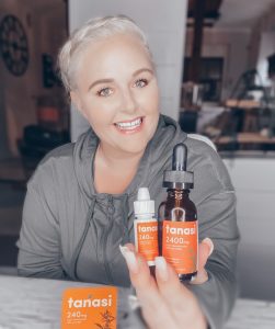 alison west holding tanasi cbd oil tincture and cbd water soluble drink concentrate