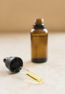 CBD oil tincture on natural background