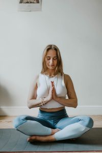 Woman practicing yoga on yoga mat