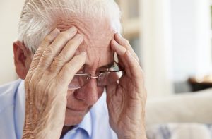 senior gentleman suffering from symptoms of dementia