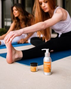 Women stretching and using CBD topicals