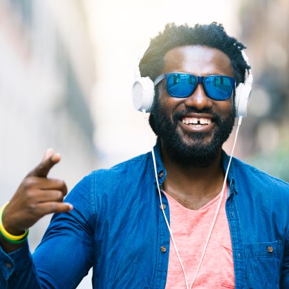 African Young Man happy after using cbd calculator to take the right cbd dose