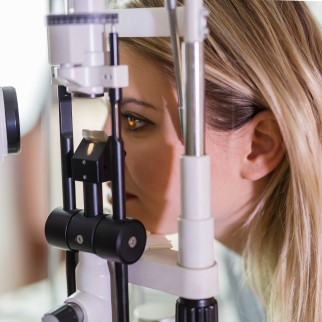 CBD Receptors In The Eye - woman undergoing an eye exam for glaucoma