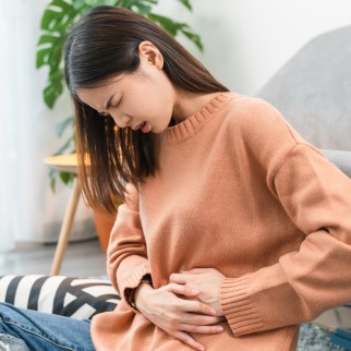 Does CBD Upset Your Stomach? - you woman suffering from stomach pain
