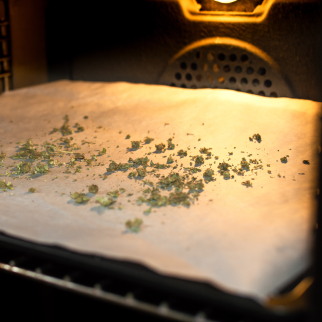 What Is Decarboxylation? - cannabis on a baking sheet inside an oven