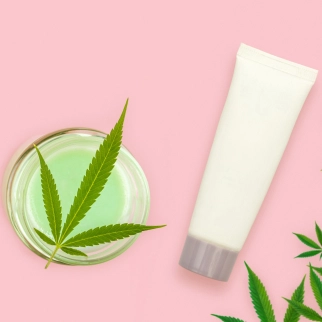 Can I Rub CBD Oil on My Skin for Pain? - cbd topical cream and cannabis leaf