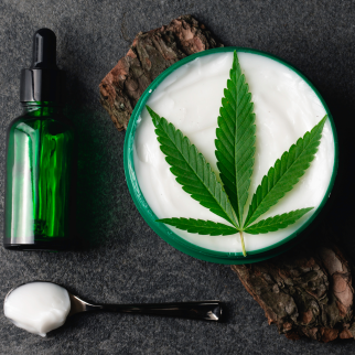 Can I Rub CBD Oil on My Skin for Pain? - cbd topical cream, cbd oil, and cannabis leaf