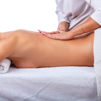 CBD Massage Benefits - woman getting acbd massage to relax
