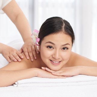CBD Massage Benefits - asian woman getting a cbd massage