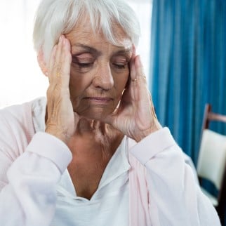 Does CBD Cause Headache - older woman having a headache