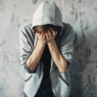 CBD Withdrawal Symptoms - GUY IN A HOODIE GOING TRHOUGH WITHDRAWAL