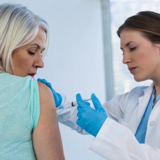 CBD Shot - a doctor putting an injection shot into a patient's arm