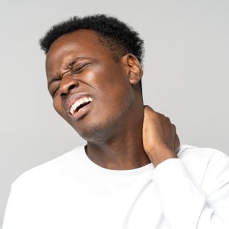 Does CBD Help With Inflammation - man with neck pain that could uise some cbd