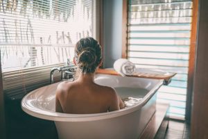 woman soaking in tub for winter skin care